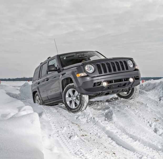 2015 Jeep Patriot climbing a snowy hill