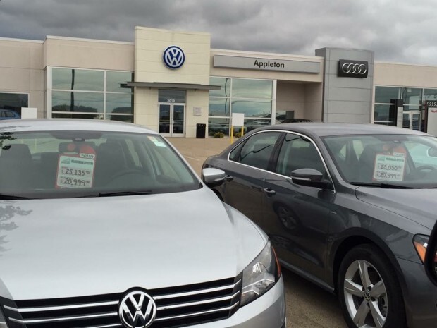 Unsold VWs sit in a dealer's lot.