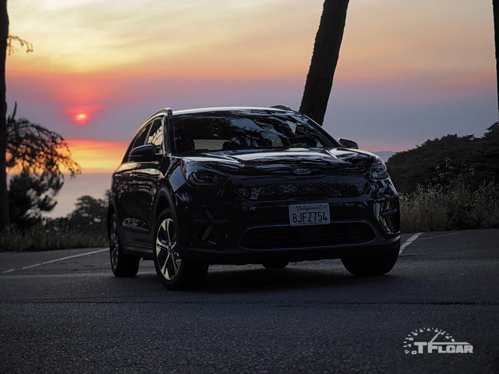 Sunset behind silohuette of Kia Niro EV