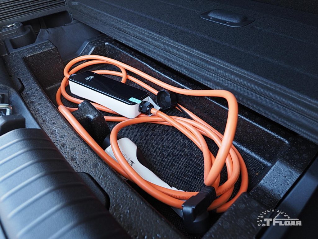 external charger stowed in underfloor storage compartment