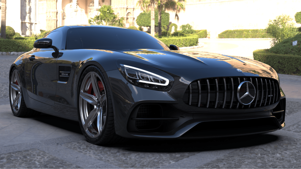 A black performance coupe parked outdoors, showcasing lightweight magnesium wheels and large brake calipers.