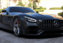 The Ultimate Guide to Magnesium Wheels for Cars A black performance coupe parked outdoors, showcasing lightweight magnesium wheels and large brake calipers.